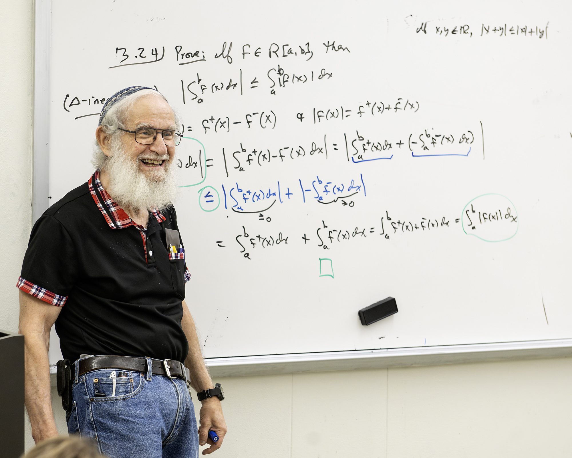 Leonard Richardson at white board covered in mathematical equations