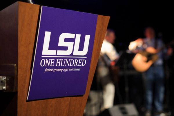 LSU100 sign on podium