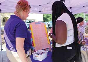 People at Academic Kick-Off Event Table