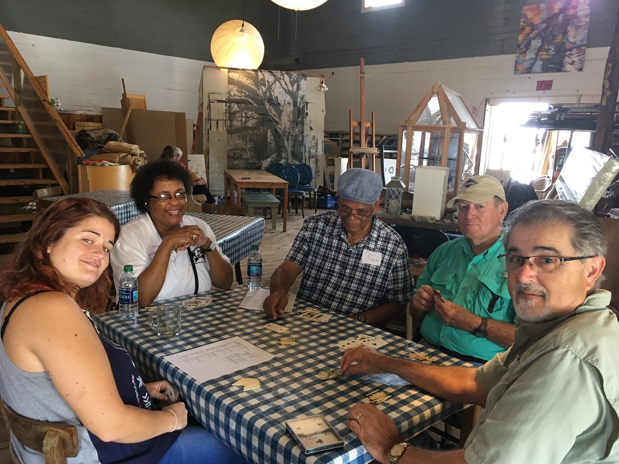 Exchange participants playing a cajun card game