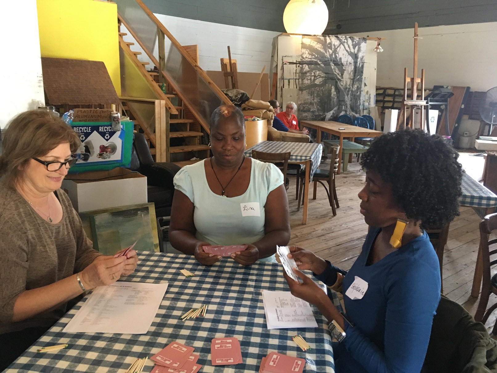 Exchange participants playing a cajun card game