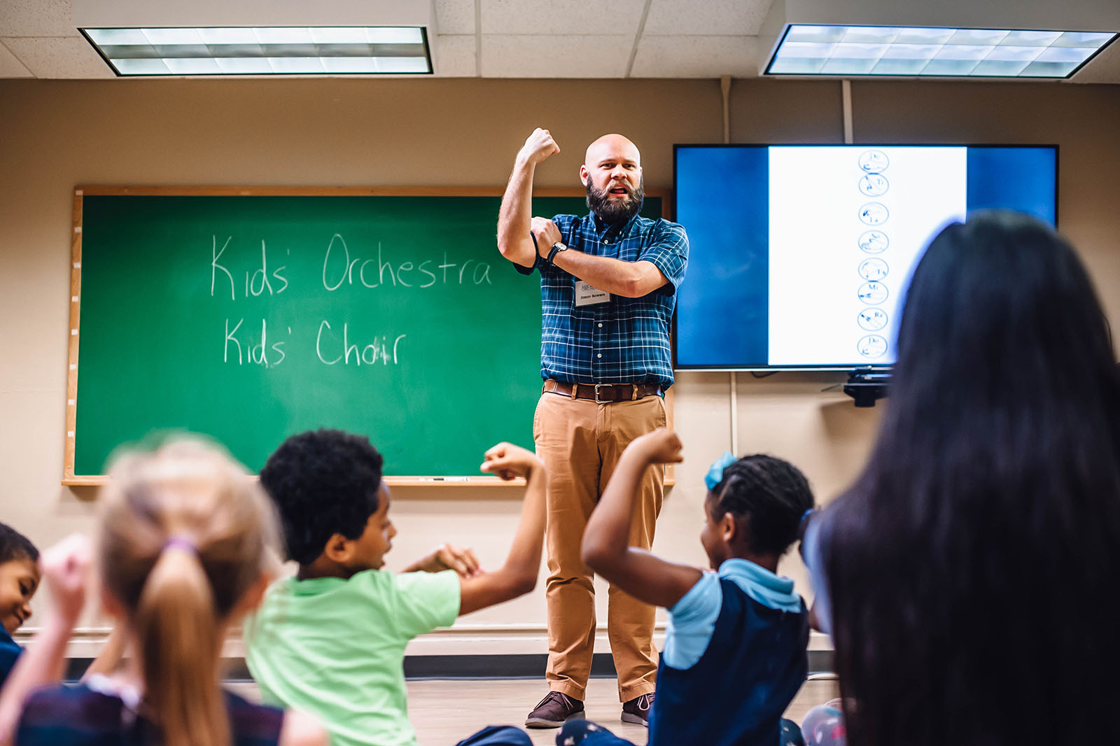 professor teaching young students