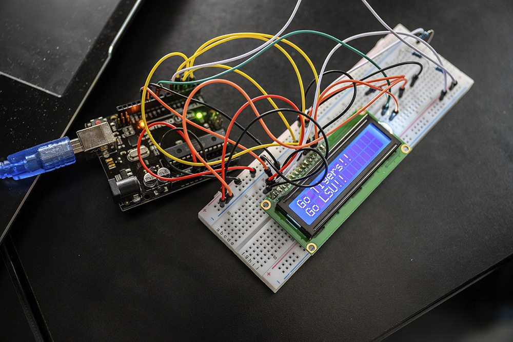 Circuit board attached to screen that says Go LSU, Go Tigers