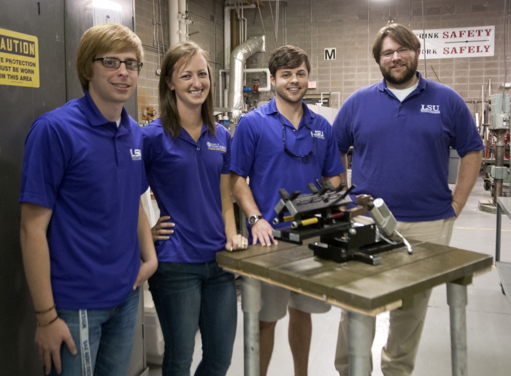 four students with capstone project