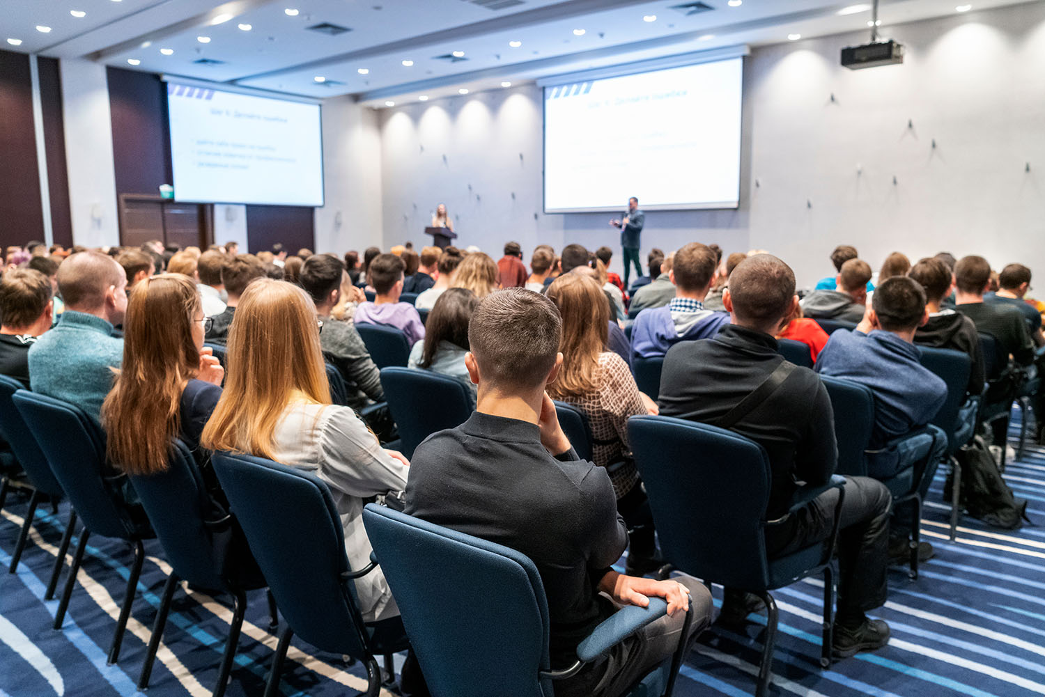 people watching a presentation in a conference room