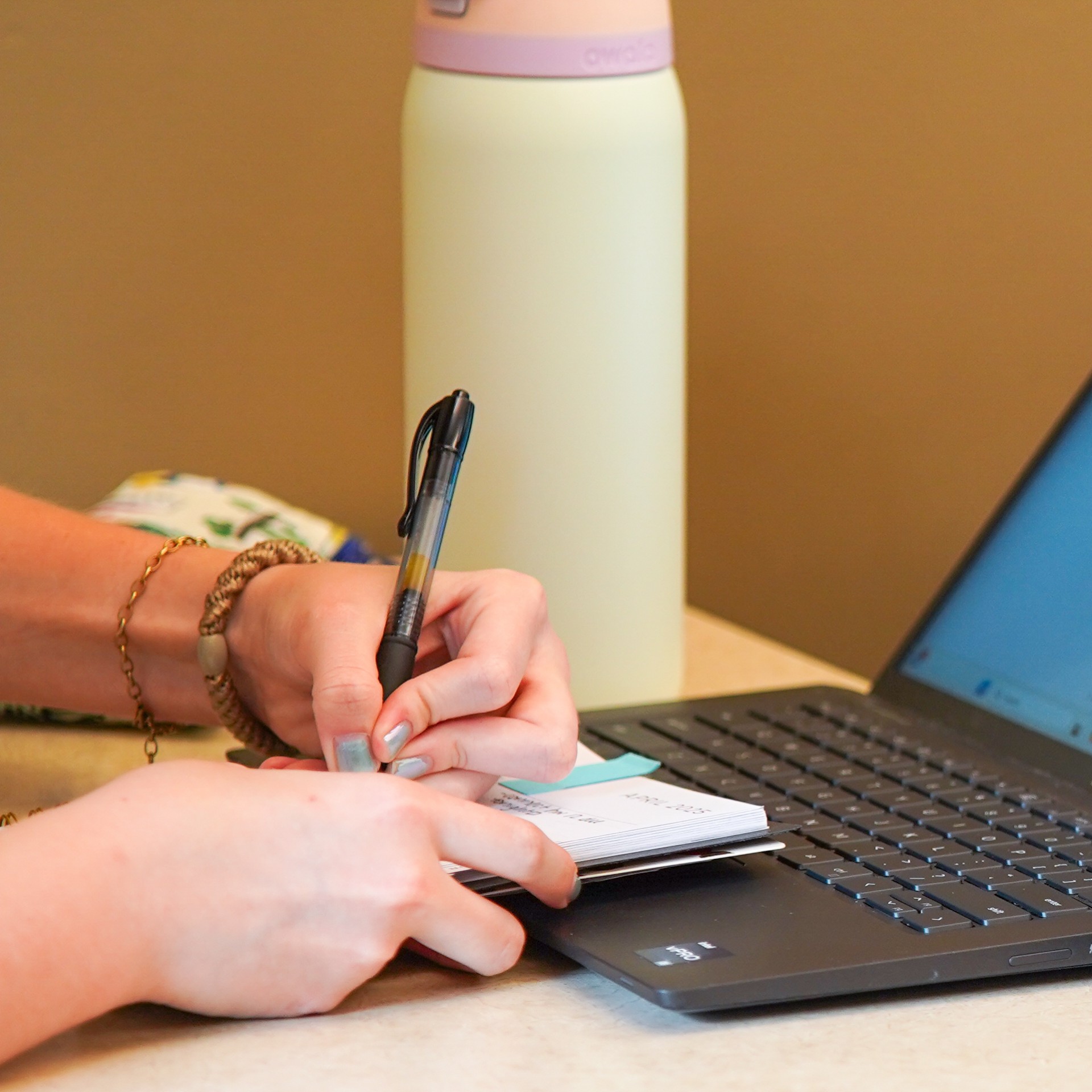 Image of hands writing