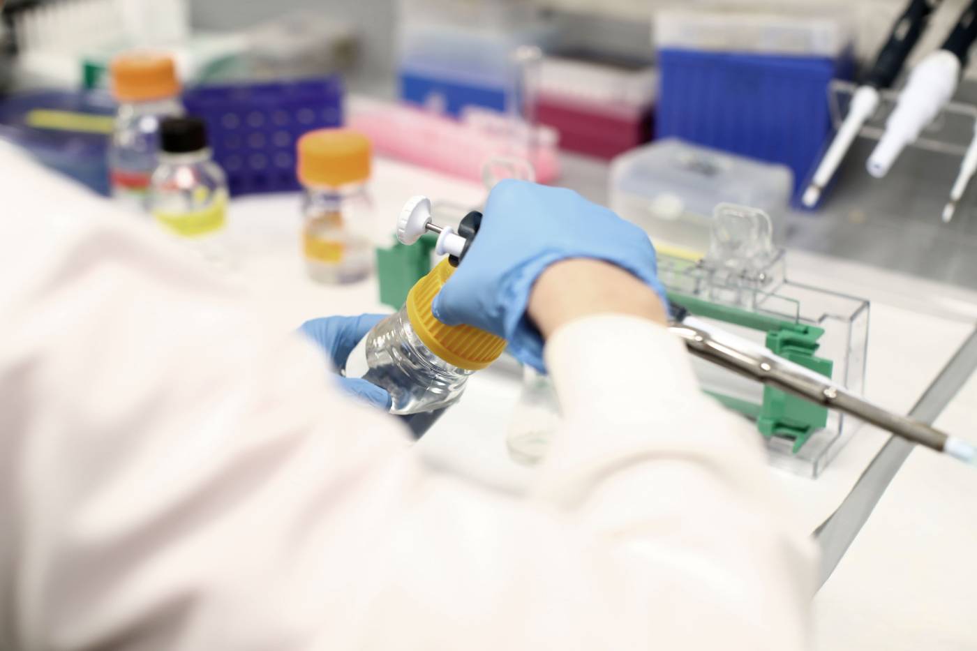 Scientist preparing to use large pipette