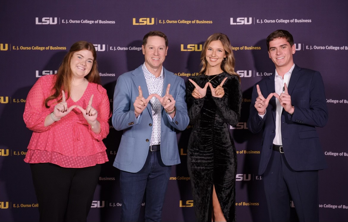 business college council members holding w hand signs with brandon landry