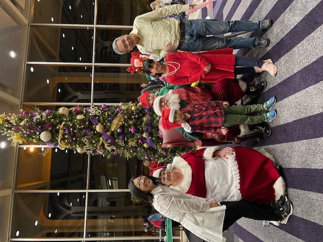 Santa Claus and Mrs. Claus with children