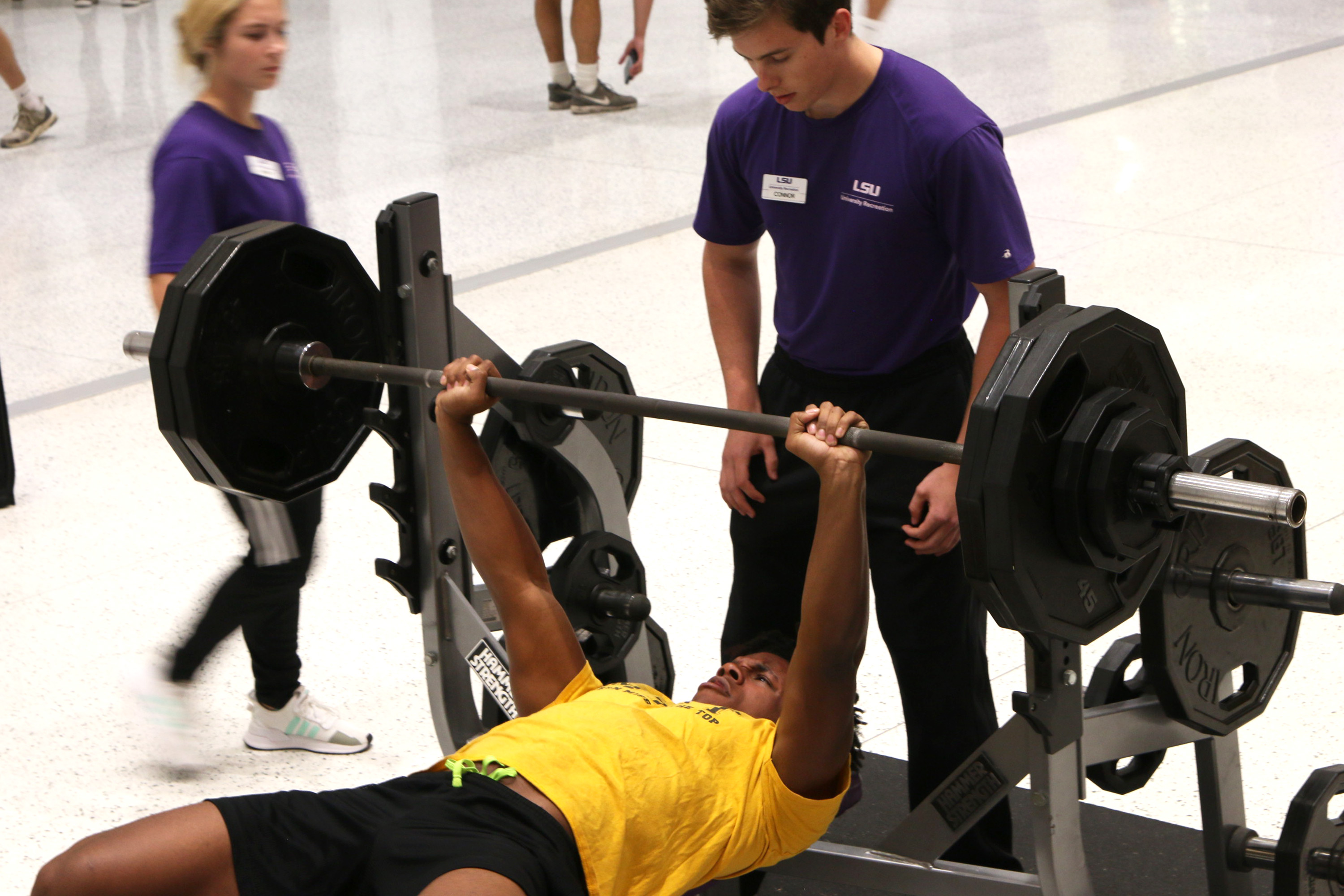 student bench pressing